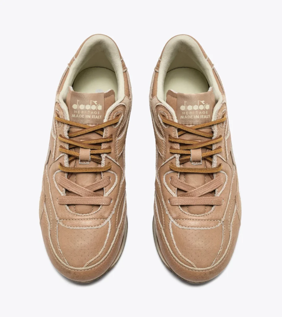Top view of the Diadora Equipe Revenge Dune Used Italia sneakers showing stonewashed dune leather upper, suede leather laces, perforated toe box, and “Diadora Heritage Made in Italy” tongue branding