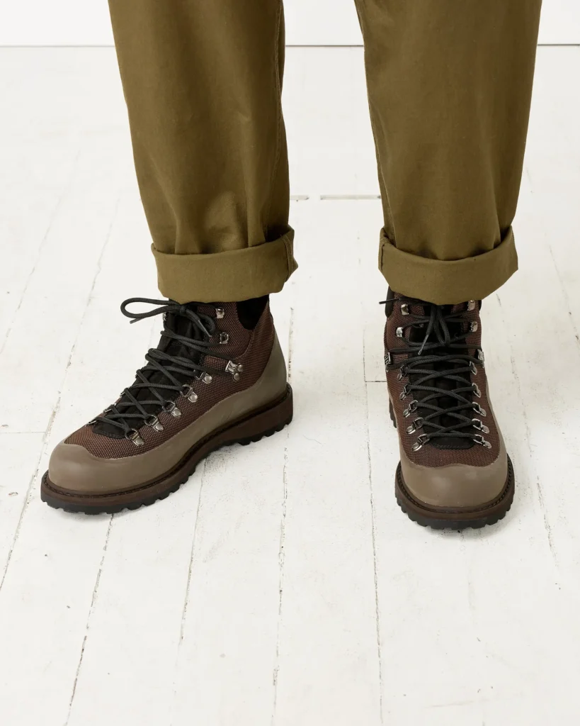 Olive suede Diemme hiking-inspired sneaker from the SS 2026 collection featuring tonal laces, a reinforced black rubber toe cap, and a rugged lugged outsole designed for durability and traction