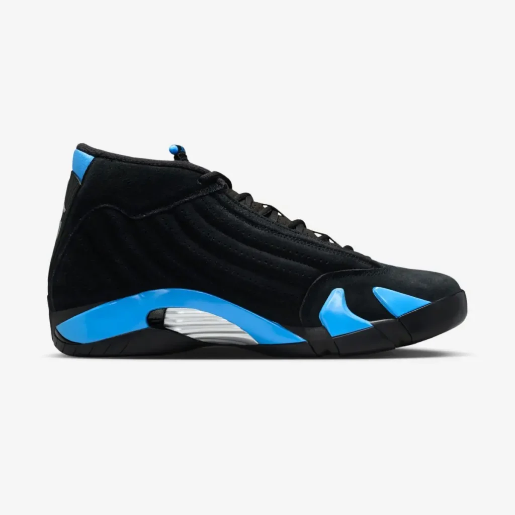 Medial side view of the Air Jordan 14 “University Blue” sneaker featuring a black nubuck upper, bright University Blue midsole accents, and a sculpted silver midfoot plate inspired by sports car design