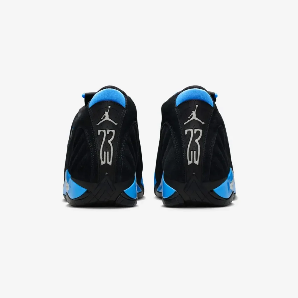 Rear view of the Air Jordan 14 “University Blue” sneakers showing the black nubuck heel, silver “23” numbering with Jumpman logo, and bright University Blue accents along the midsole and collar