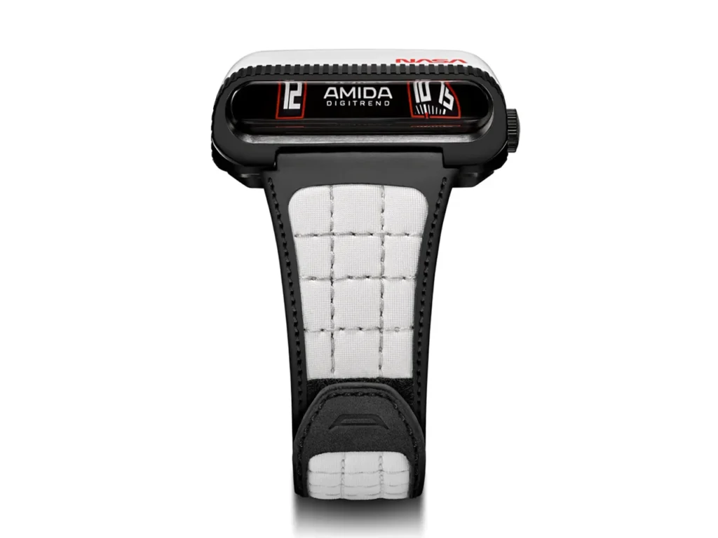 Retro-futuristic AMIDA Digitrend NASA edition watch with a horizontal prism-style digital display, black case with red accents, and a white quilted technical strap, shown against a clean neutral background