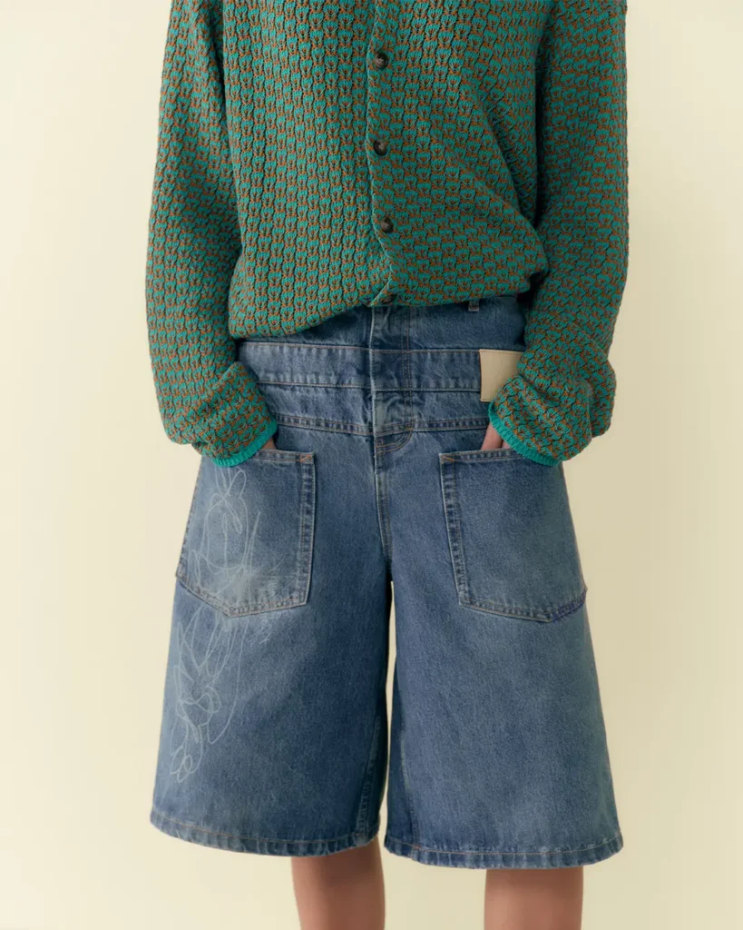 textured knit cardigan from the Axel Arigato campaign introducing the Akaia emblem in collabo with Reggieknow