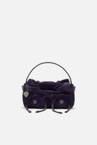 Violet purple Acne Studios multipocket micro bag in a compact rectangular silhouette, featuring gathered leather detailing, two front flap pockets with drawstring ties, subtle metal logo buttons, and a small heart-shaped charm on the side. The bag has a structured top handle in black leather and a softly textured finish, presented against a clean white background