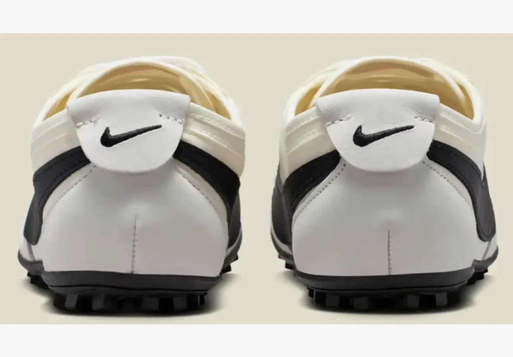 Rear view of Nike Moon Shoe showing white leather heel tabs, black Swoosh detail, and waffle outsole traction