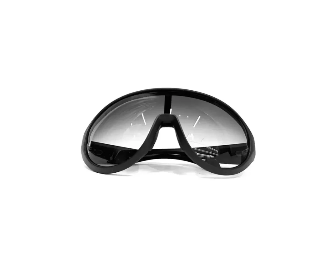 Rick Owens x Moncler black wraparound sunglasses featuring an oversized single shield lens with a dark gradient tint and sculptural matte black frame, reflecting the futuristic aesthetic of the Moncler Genius collab