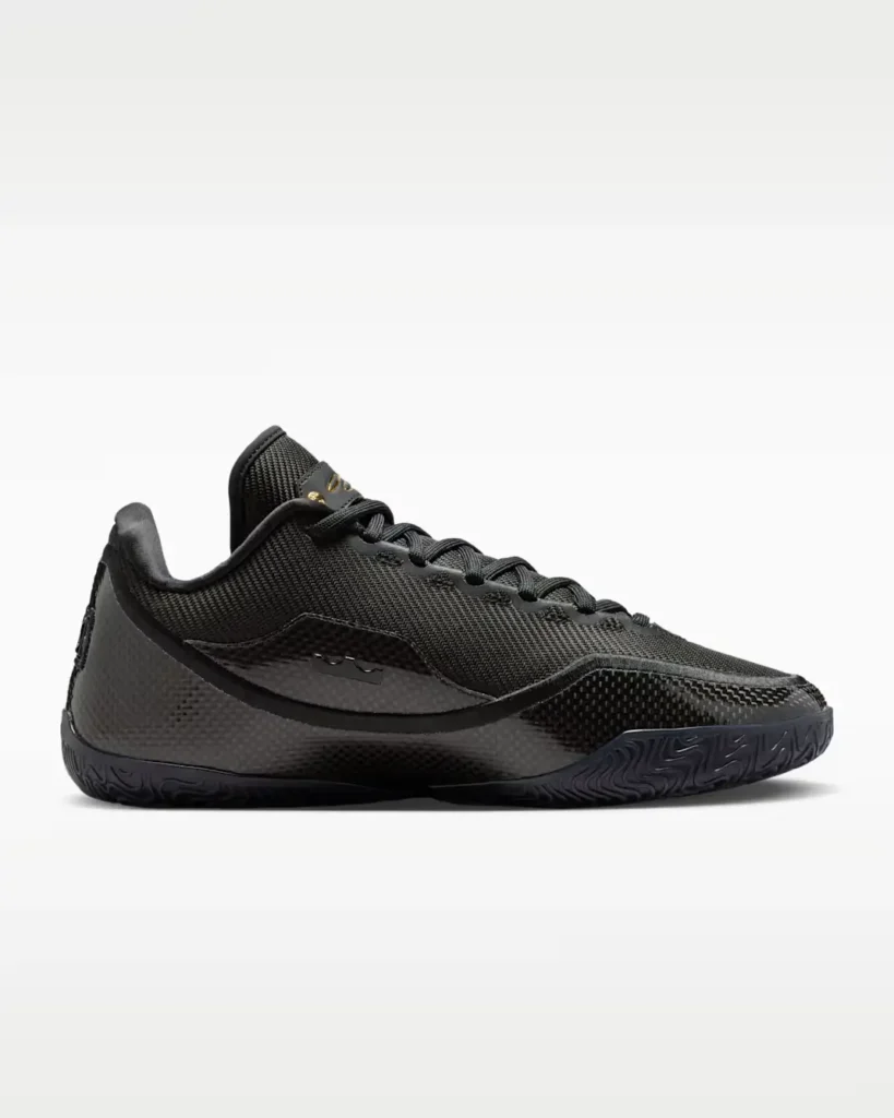 Side profile of Nike LeBron XXIII “Masked Menace” basketball shoe in all-black with textured woven upper, sculpted midsole, and low-cut performance silhouette on a clean background