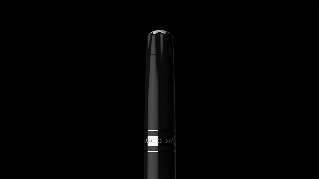 Classic black Montblanc fountain pen with signature white star emblem on cap against a black background