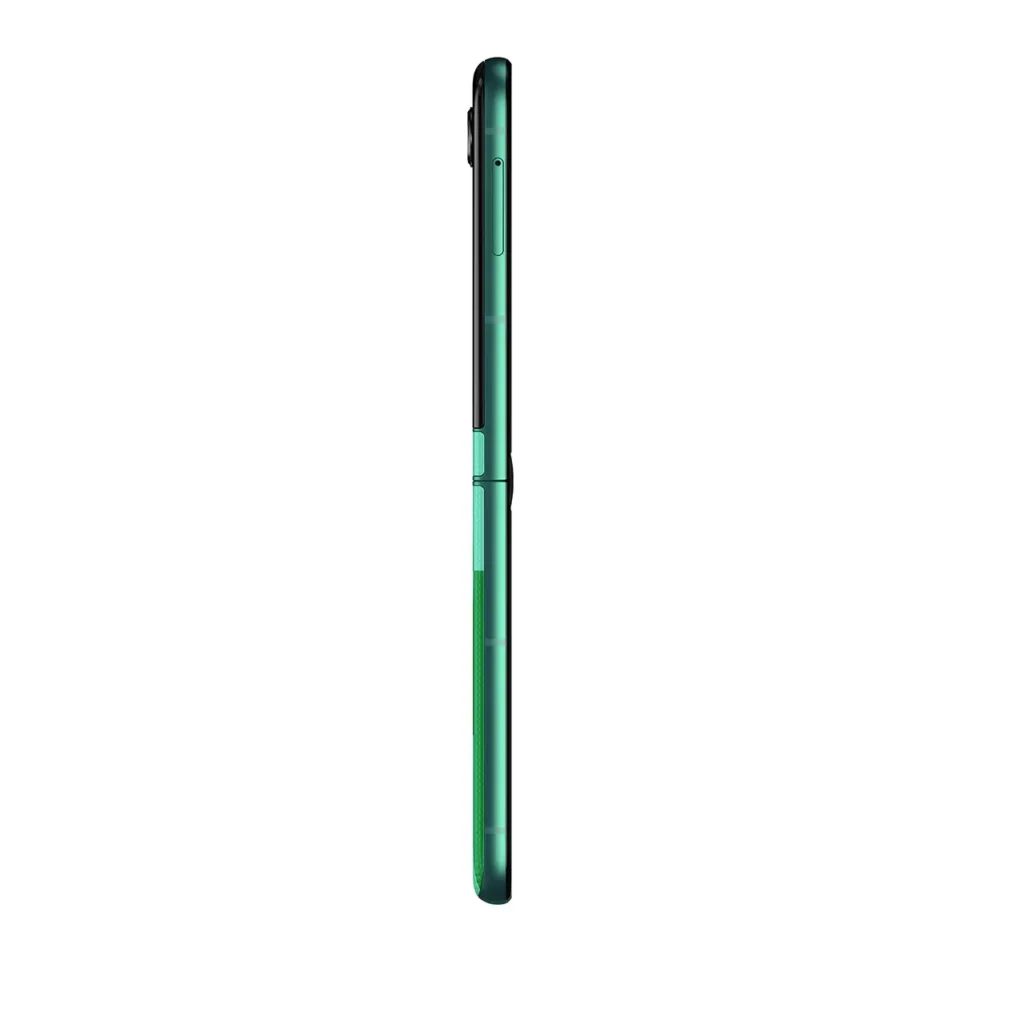 Ultra-slim side profile view of the Motorola Razr FIFA World Cup 26™ Edition shown vertically in its closed position. The metallic green aluminum frame runs seamlessly from top to bottom, with the hinge break visible at the midpoint. A slightly raised dual-camera module protrudes subtly near the top edge on the rear side. The power button and volume rocker are integrated along the frame, and the textured green back panel is faintly visible along the lower half. The device is photographed against a clean white background, emphasizing its thin foldable construction and commemorative green finish