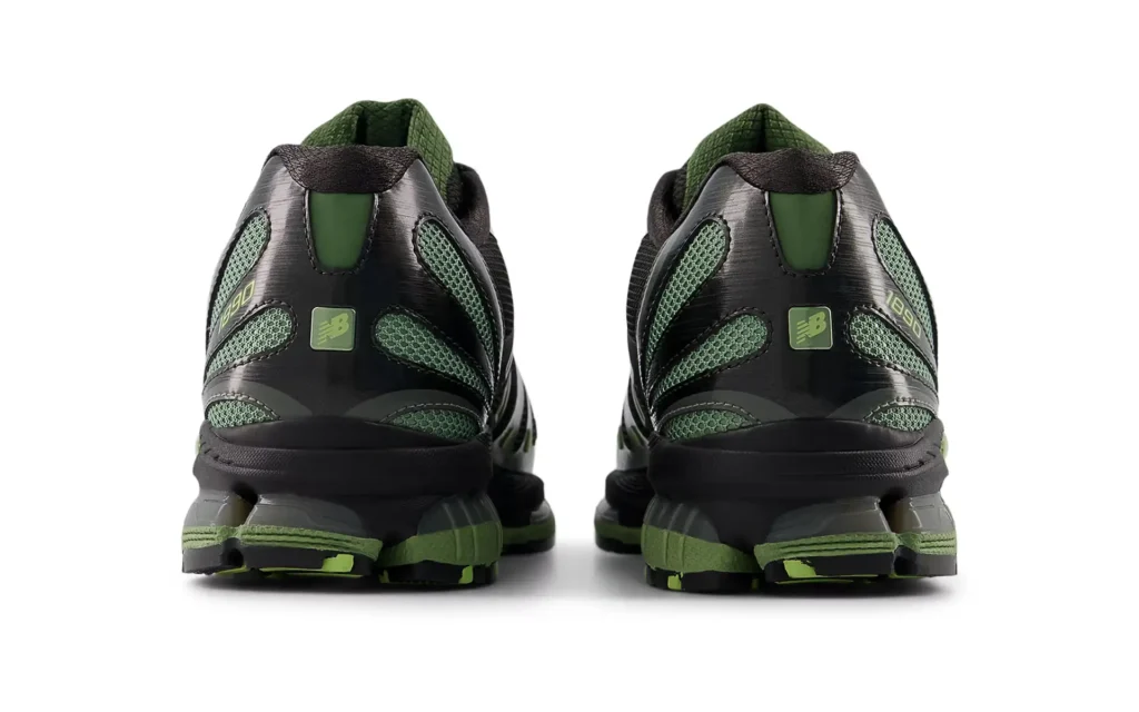 Rear view of the New Balance 1890 “Black Utility Green” sneakers, highlighting the sculpted heel structure, breathable mesh panels, and segmented ABZORB cushioning on the outsole