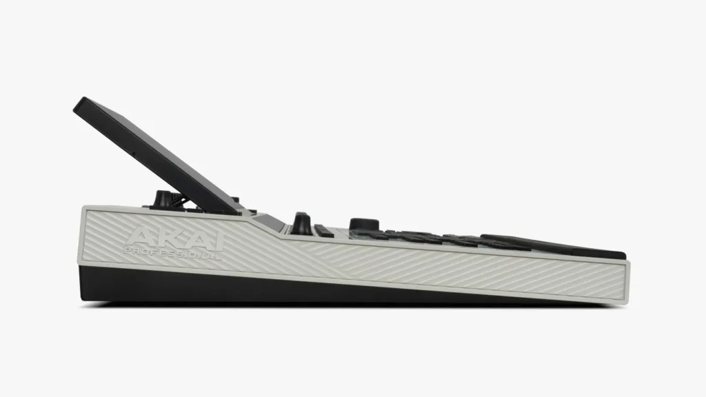 Side profile of the Akai Professional MPC XL music production workstation, showing its angled touchscreen display, textured side panel with embossed Akai logo, and slim black base design against a neutral background