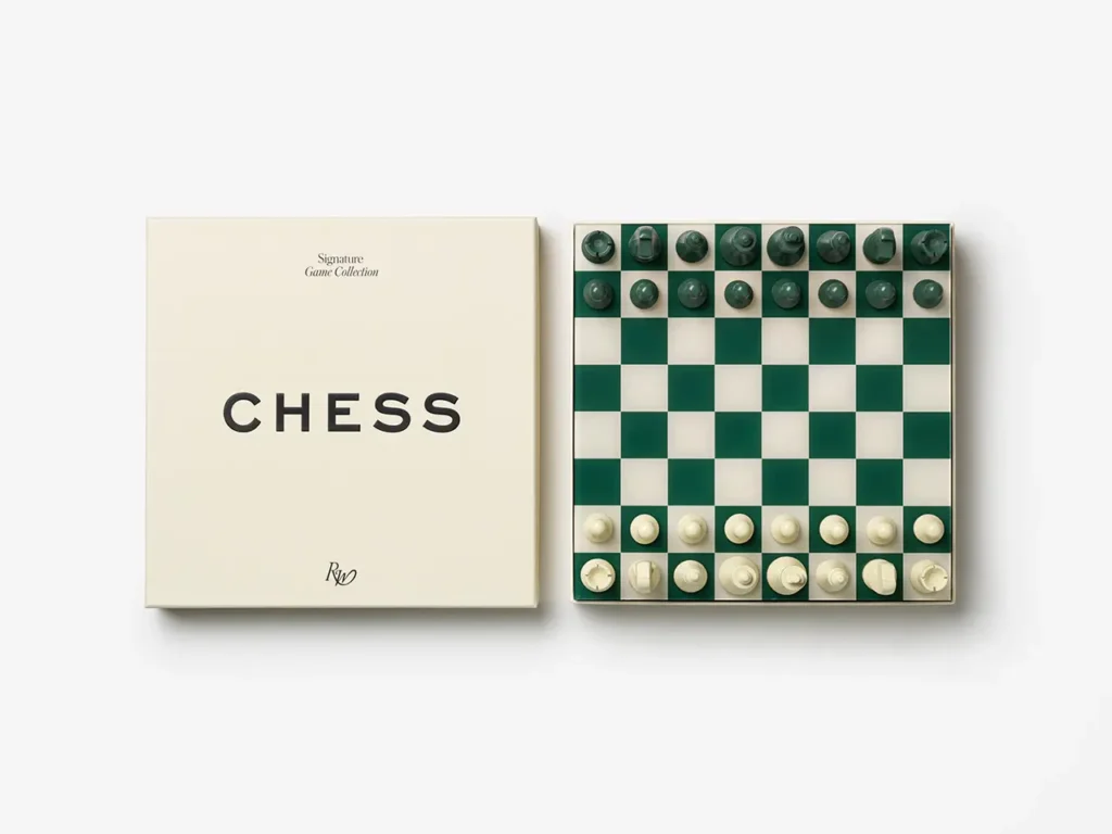 PRINTWORKS × Rosewood chess set with green and cream board and minimalist pieces beside the game box