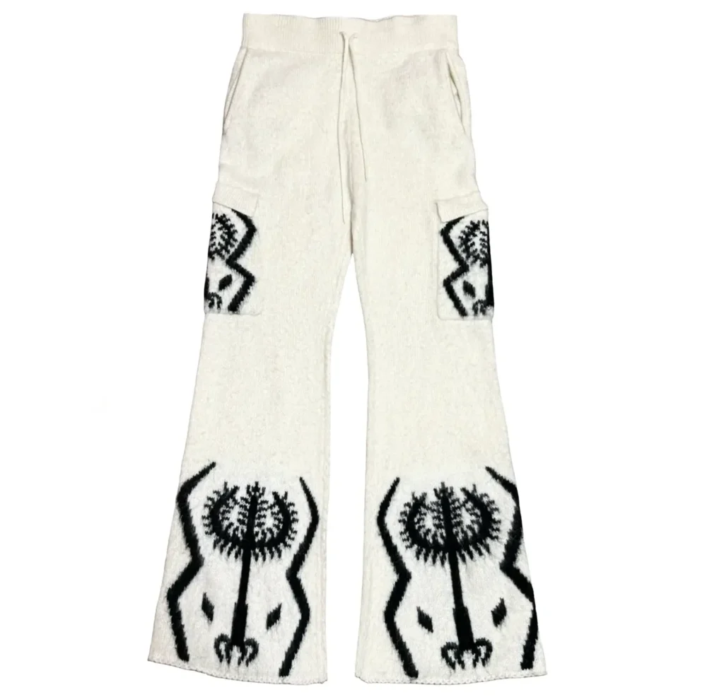 White mohair knit pants from the Sacred Tree set featuring black Sacred Tree graphics along the lower legs and tribal-style motifs on the side cargo pockets