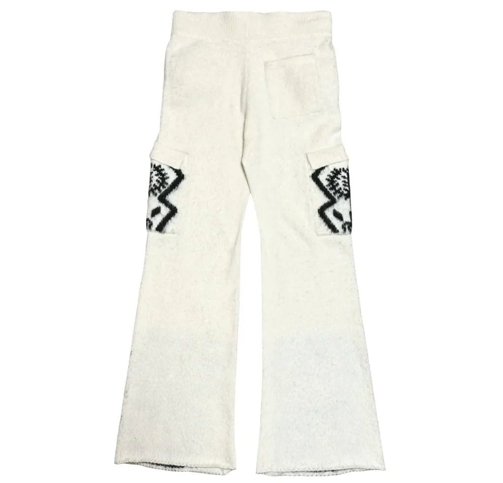 Rear view of white mohair knit Sacred Tree pants featuring a soft textured fabric, back pocket detail, and black tribal-style graphics on the side cargo pockets