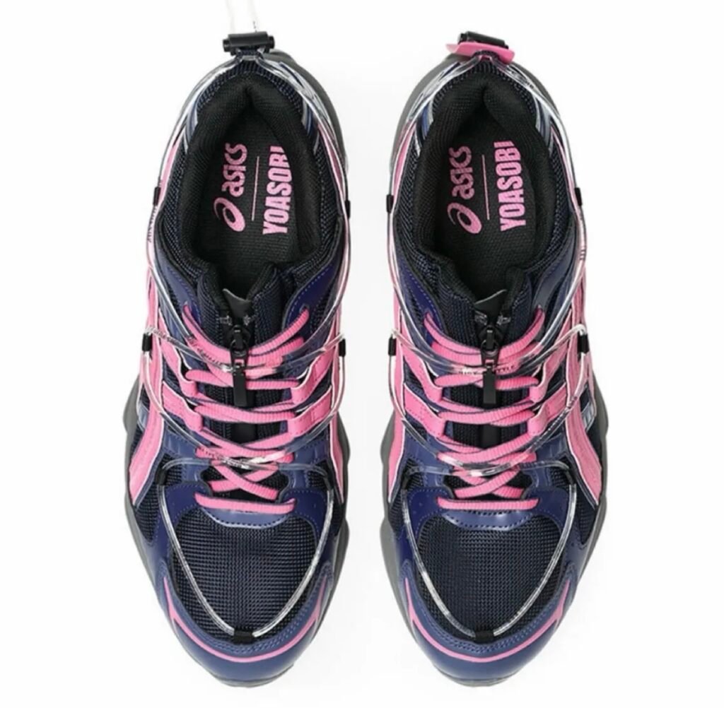 Top view of the pink and navy YOASOBI x ASICS GEL-Kinetic Fluent sneaker featuring mesh upper and co-branded ASICS YOASOBI insole
