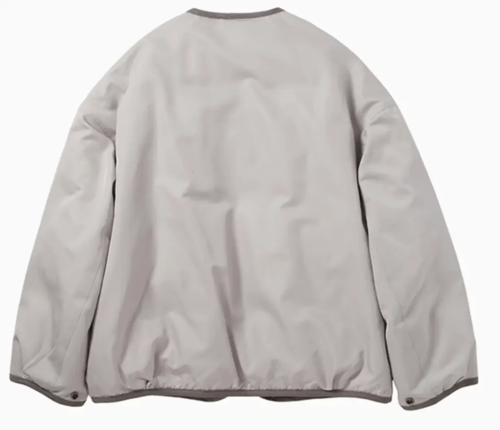 Back view of Visvim WMV Liner Down JKT W in silver with minimalist collarless design and smooth wool-silk shell