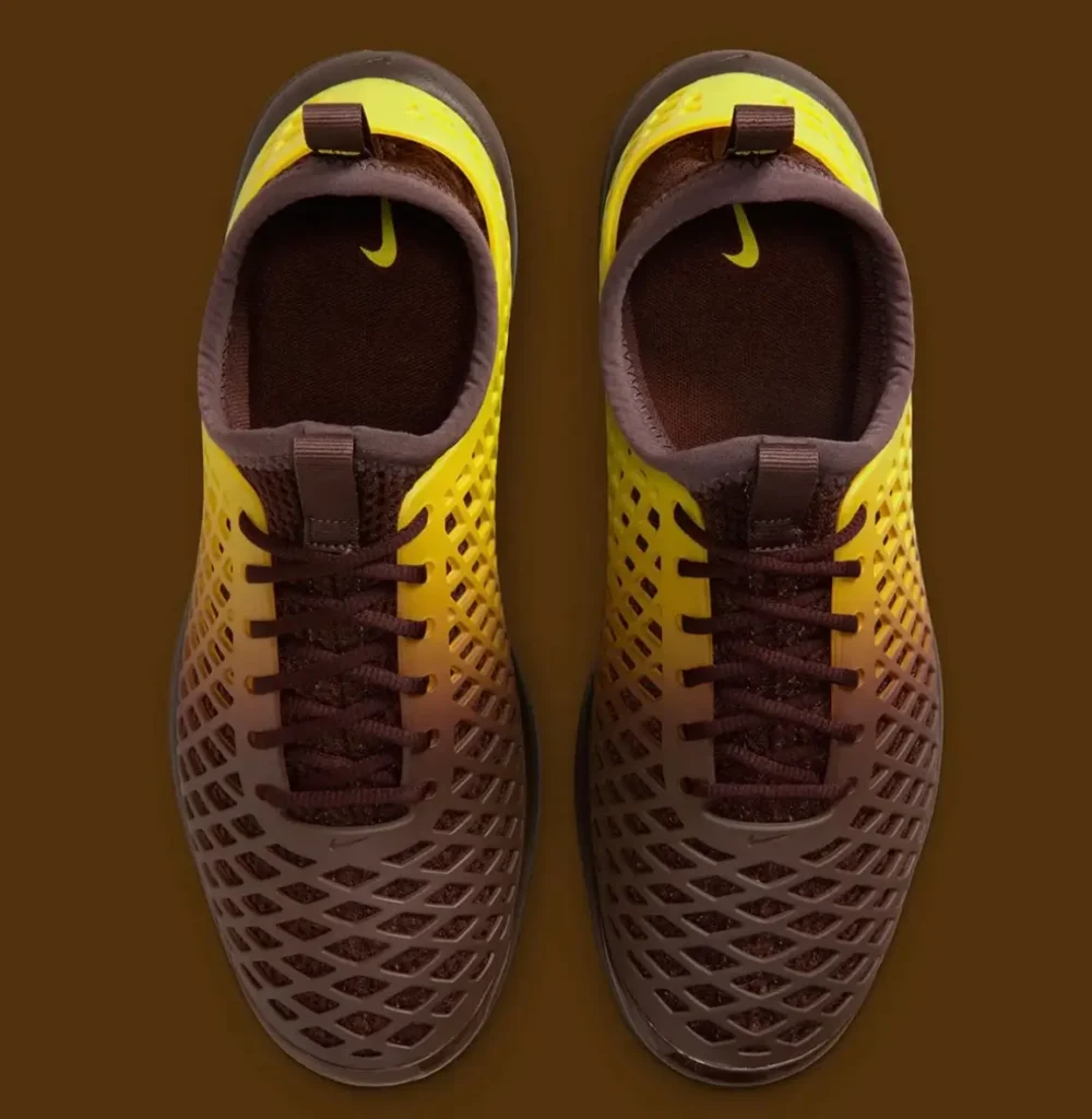 Top view of Nike Rejuven8 Run Retro gradient sneakers with brown-to-yellow perforated shell upper