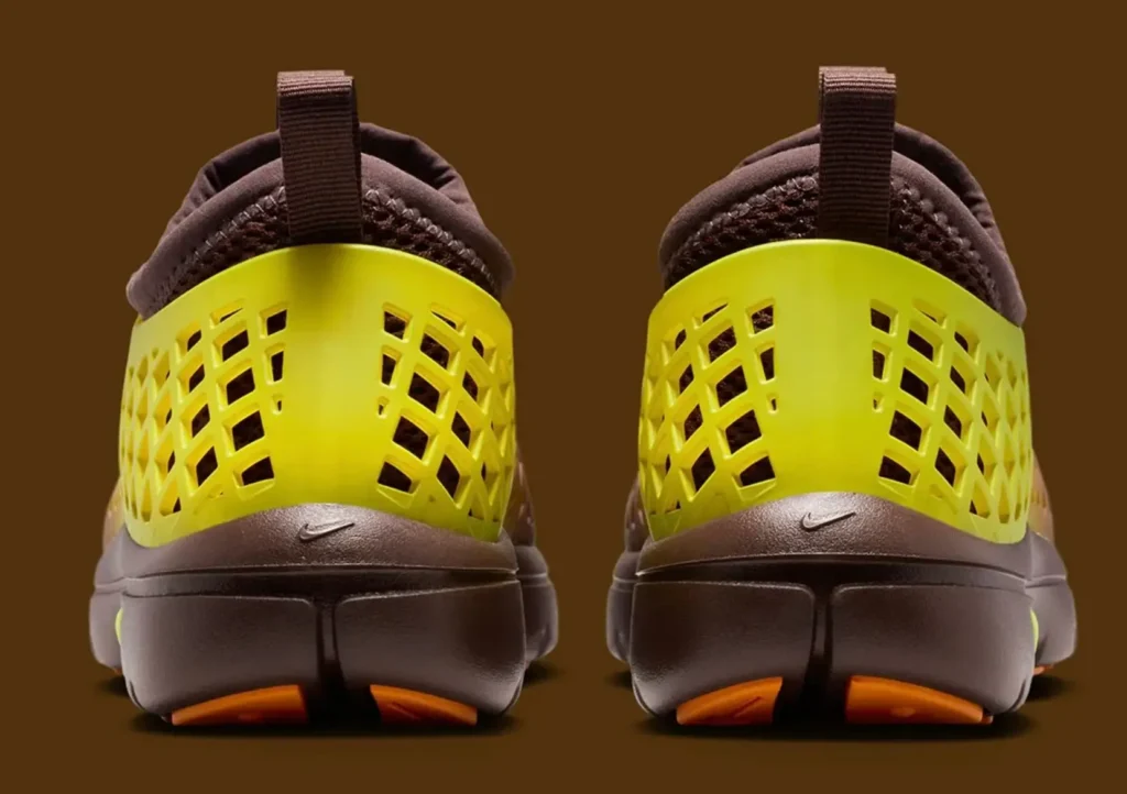 Nike Rejuven8 Run Retro heel detail with yellow lattice shell and neon green Swoosh