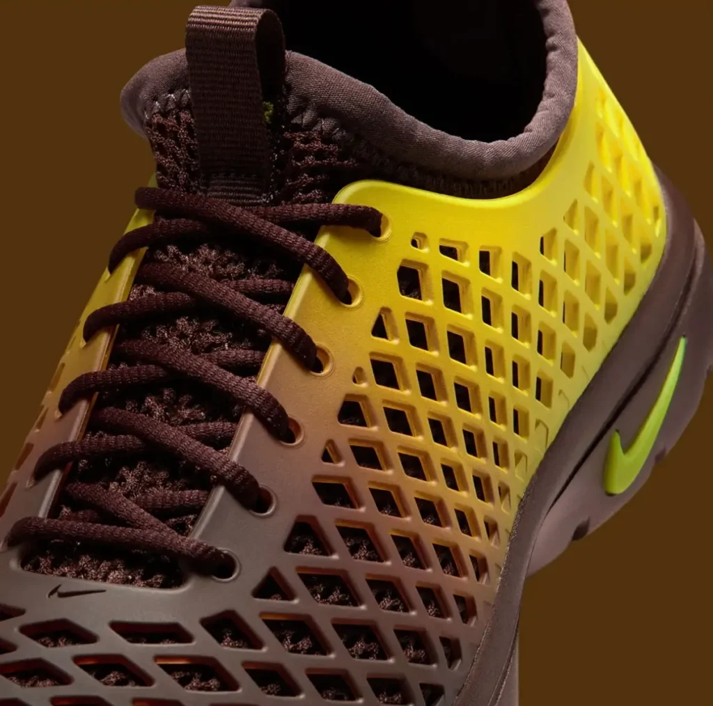 Close-up of Nike Rejuven8 Run Retro gradient shell with brown laces and neon green Swoosh