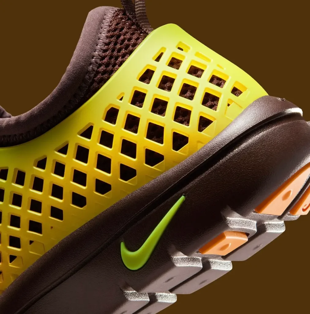 Nike Rejuven8 Run Retro heel detail with yellow lattice shell and neon green Swoosh