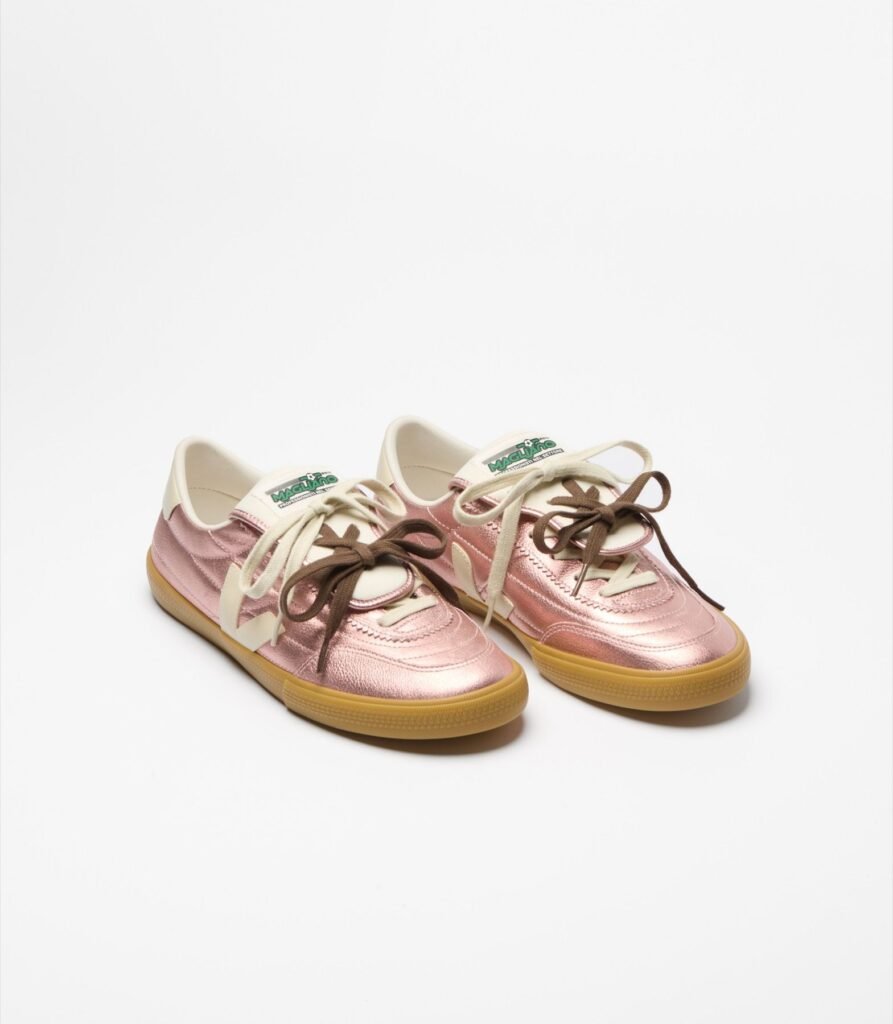 Magliano x VEJA Panenka shoes in pearlescent pink leather with cream and brown laces, featuring a fold-over football-style tongue and gum sole