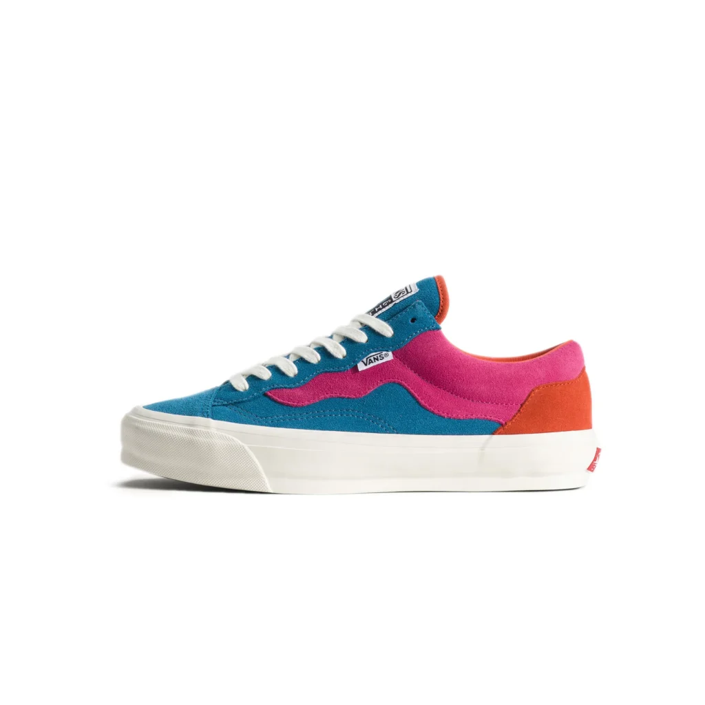 Parra x Vans OTW Old Skool 36 sneaker in quad-toned suede, featuring teal blue base panels, wavy pink overlay replacing the Sidestripe, orange heel accent, white laces, and off-white vulcanized sole against a clean studio background
