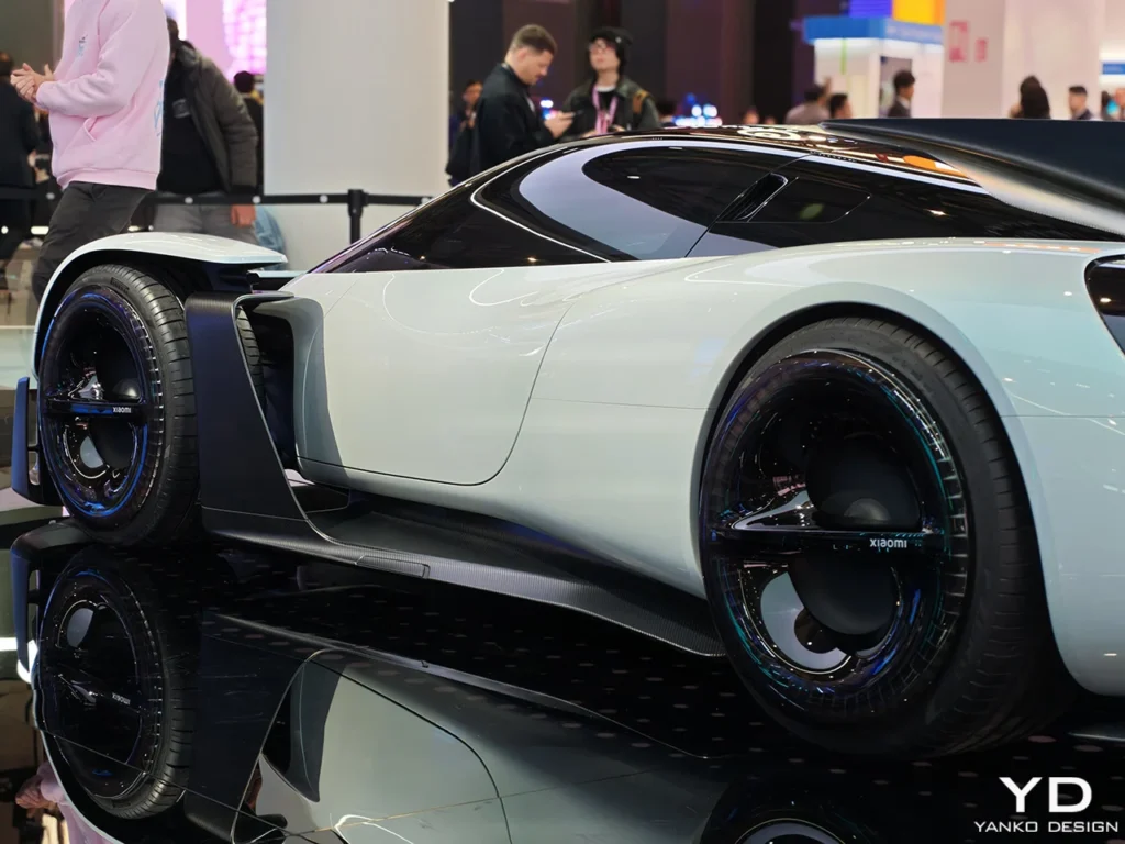 Front three-quarter view of the Xiaomi Vision Gran Turismo electric hypercar concept displayed at Mobile World Congress 2026, featuring sleek LED lighting, aerodynamic bodywork, and futuristic EV design
