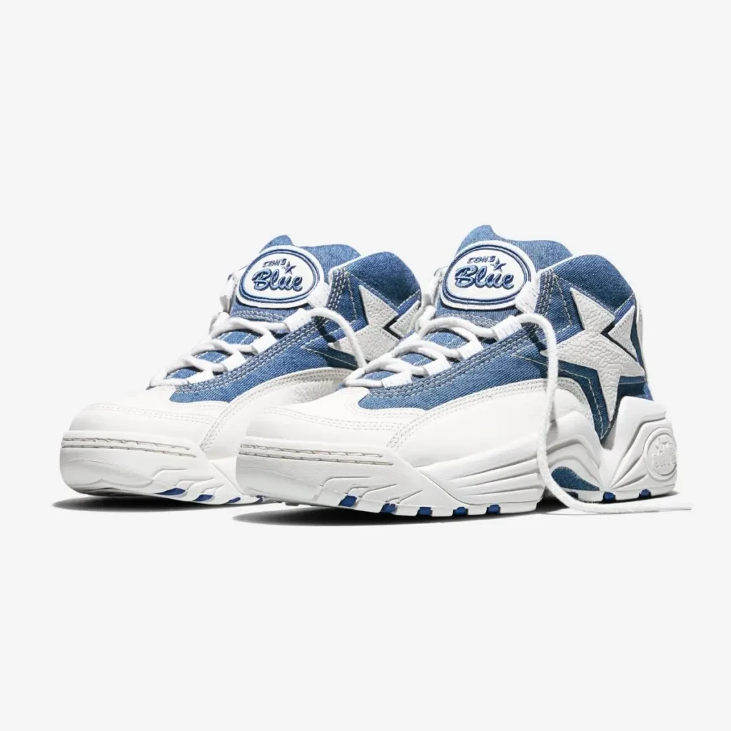 Converse CONS Mid “Kentucky Denim” sneakers in Federal Blue and Vintage White featuring blue denim panels, white leather overlays, star-chevron branding, and CONS Blue tongue labels in a front three-quarter view