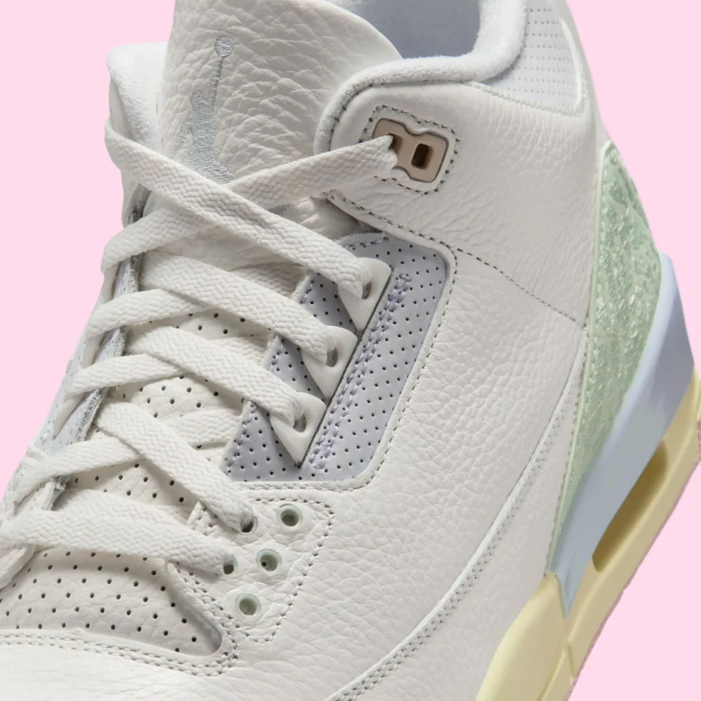 Close-up of Air Jordan 3 OG “Spring Is in the Air” with white tumbled leather, pastel eyelets, and soft green heel accent