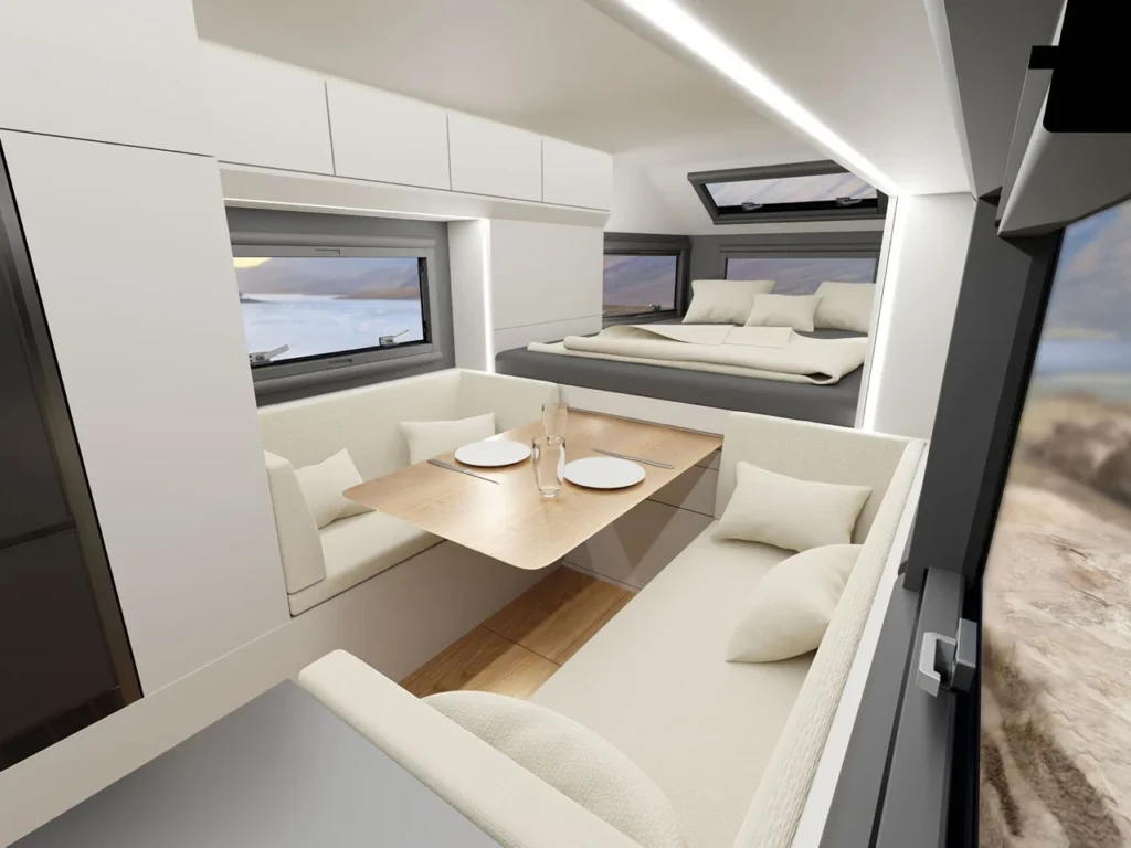 GEHOcab EDGE Explorer Trail interior with minimalist dining area and sleeping loft in compact off-grid camper design