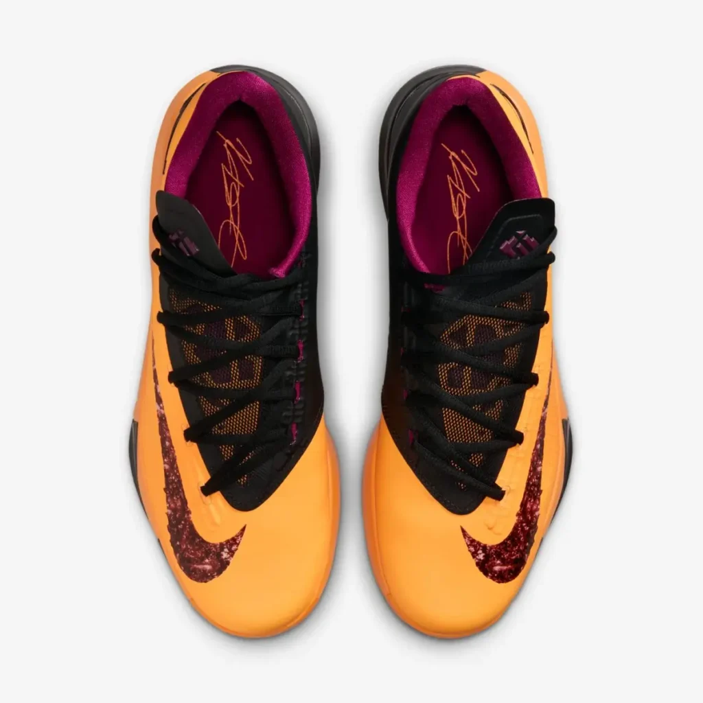 Top view of Nike KD 6 “Peanut Butter & Jelly” 2026 sneakers with orange upper, jelly-textured Swoosh, black laces, and purple inner lining