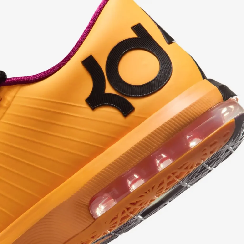 Close-up of Nike KD 6 “Peanut Butter & Jelly” 2026 heel showing KD logo, orange upper, and visible Air cushioning unit with translucent purple tint