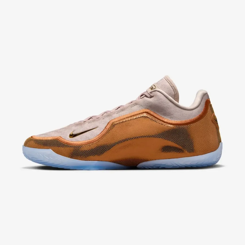 Nike LeBron 23 “LeBronto” basketball sneaker in beige and amber tones with translucent blue outsole, low-top silhouette, mesh side panel, and gold Swoosh detail