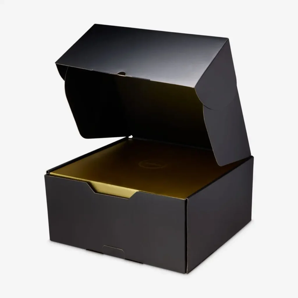 Nike LeBron 23 “LeBronto” shoebox with matte black exterior and metallic gold inner lid, shown open to reveal premium packaging design
