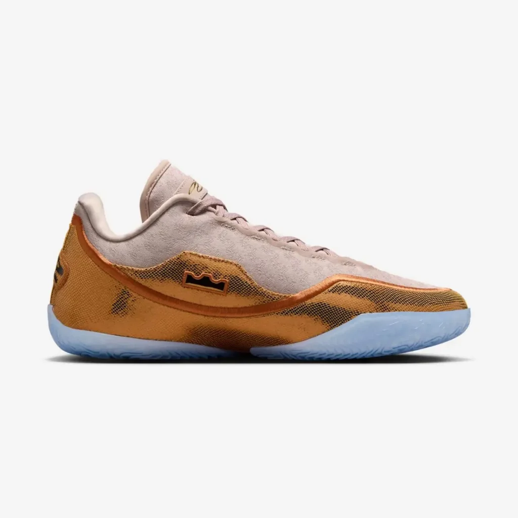 Medial side view of the Nike LeBron 23 “LeBronto” basketball sneaker featuring beige suede upper, amber mesh overlay, LeBron crown logo panel, and translucent blue performance outsole