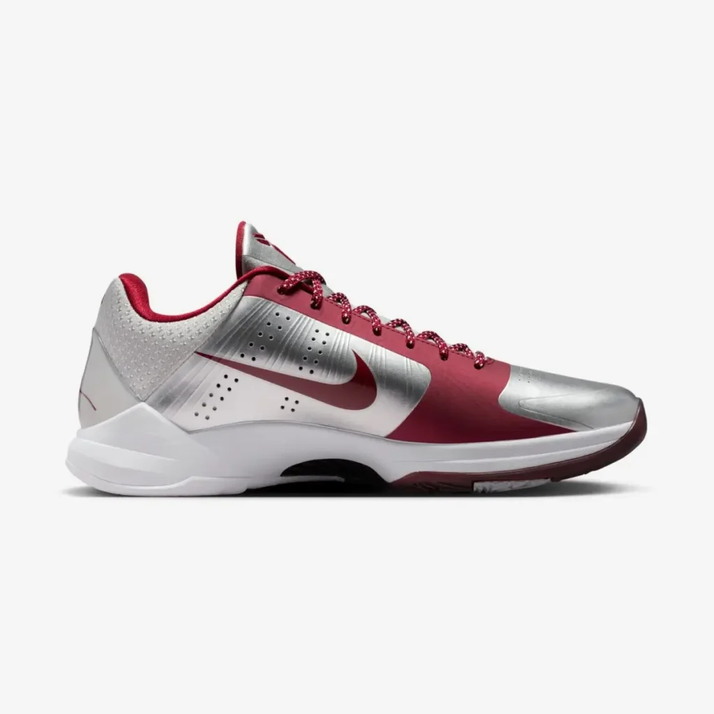 Side profile of the Nike Kobe 5 Protro “Lower Merion Aces” in metallic silver, white, and team red with red Swoosh honoring Kobe Bryant
