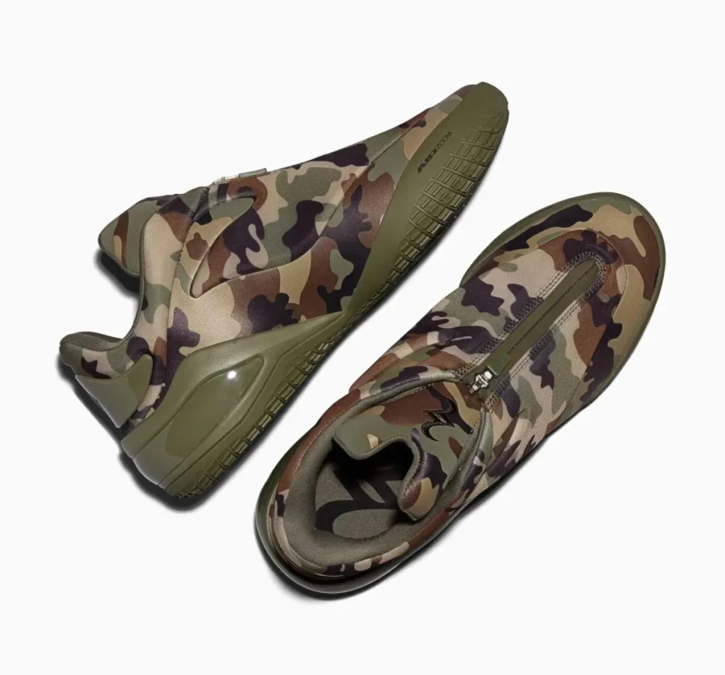 Top-down and rear three-quarter view of the Converse SHAI 001 “Camo” basketball shoe featuring a full camouflage upper, zippered shroud closure, and olive midsole with sculpted heel support