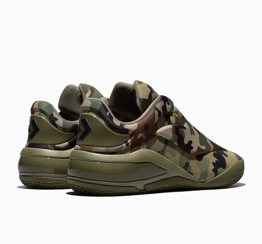 Rear three-quarter view of the Converse SHAI 001 “Camo” basketball sneakers showing camouflage upper, padded collar, molded olive heel counter with chevron-star branding, and sculpted midsole cushioning