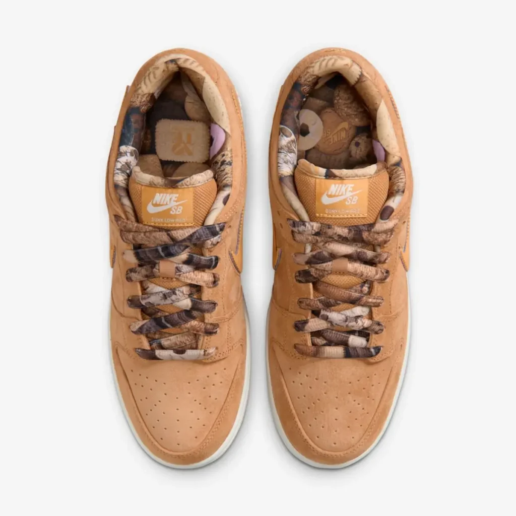 Top-down view of NOTE x Nike SB Dunk Low “Brew & Biscuits” showing biscuit-brown suede uppers, marbled coffee-toned laces, patterned inner lining, and Nike SB tongue labels with off-white midsoles