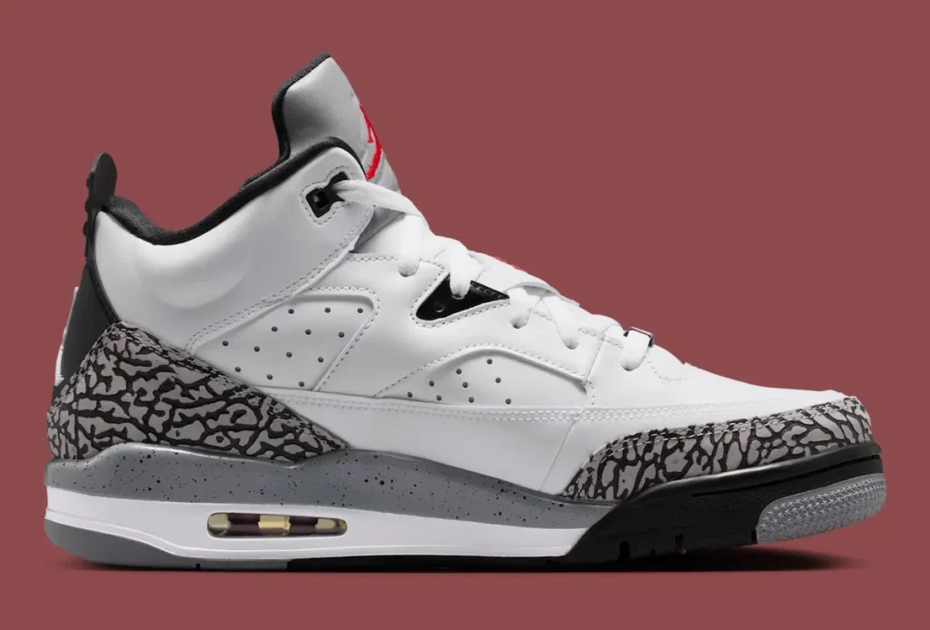 Jordan Son of Mars “White Cement” sneaker in medial side view featuring white leather panels, grey elephant print overlays, speckled midsole with visible Air unit, and black outsole detailing