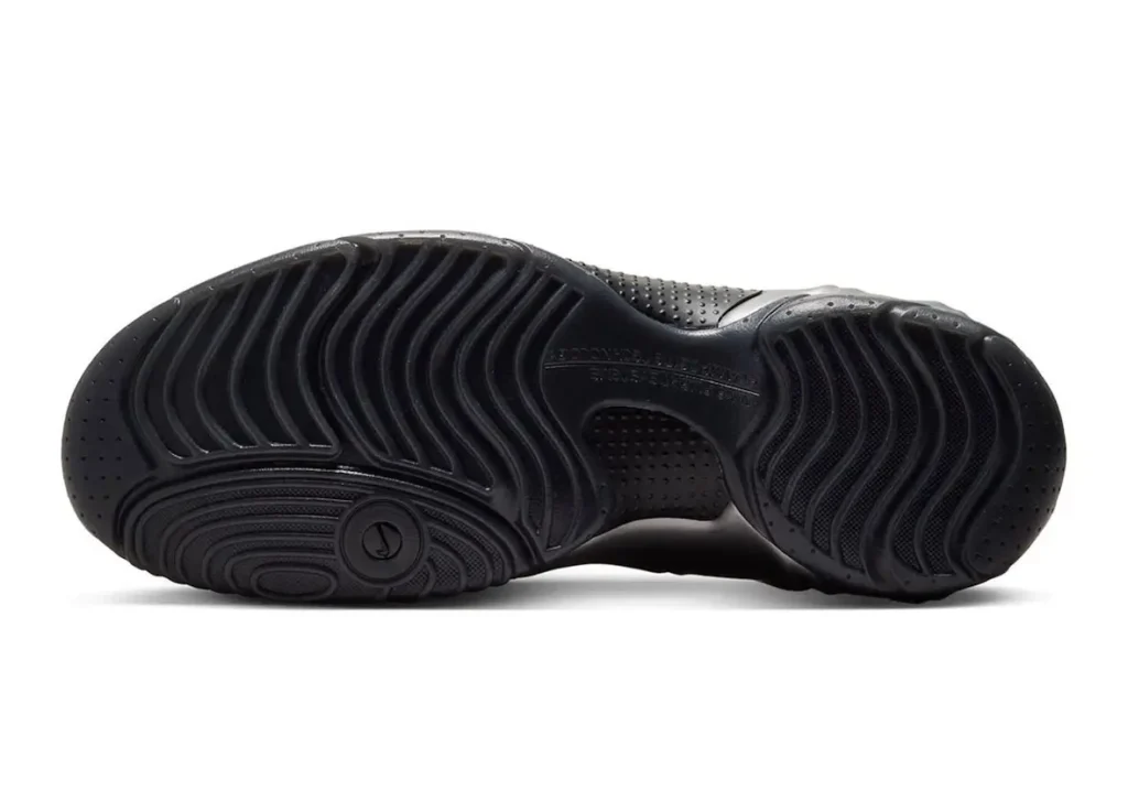 Nike Clogposite “Metallic Dark Grey” outsole detail showing rippled traction pattern in black rubber with circular pivot zone and sculpted grooves for grip