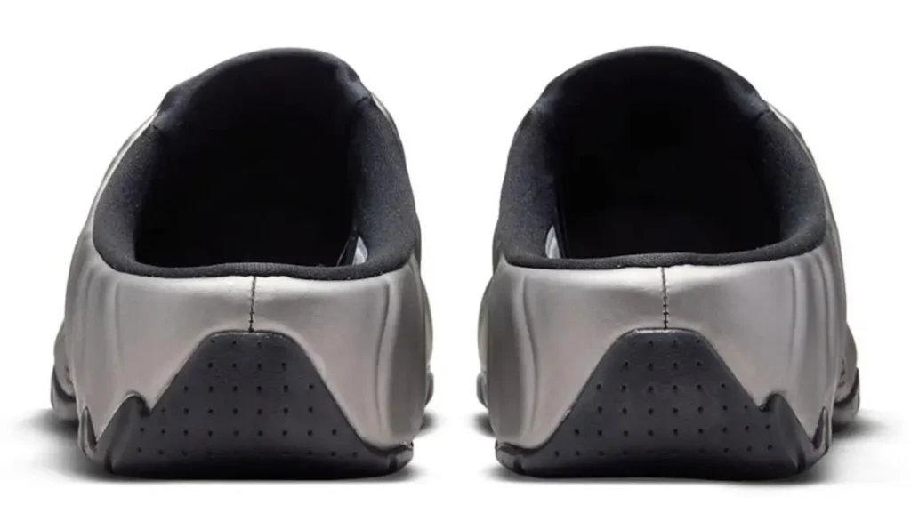 Rear view of Nike Clogposite “Metallic Dark Grey” showing open-heel mule design, padded black lining, and sculpted metallic upper with perforated black heel panel