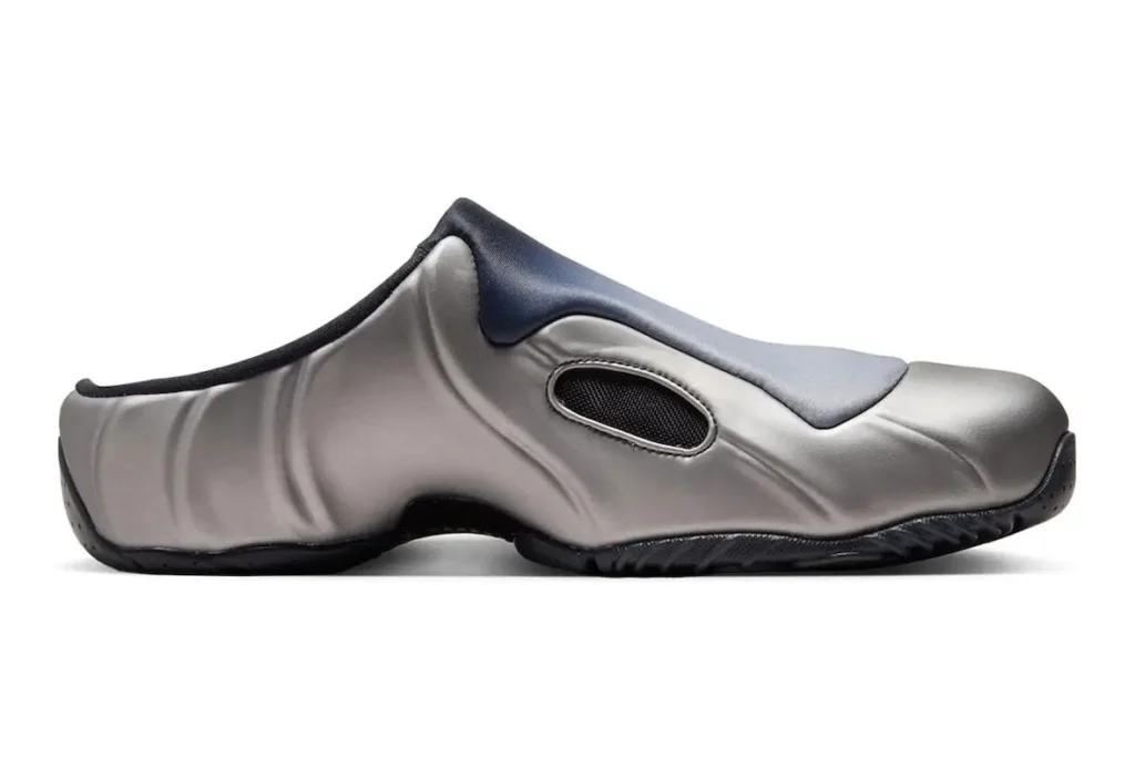 Side profile of Nike Clogposite “Metallic Dark Grey” featuring sculpted metallic upper, oval mesh vent, gradient shroud, and black rippled outsole