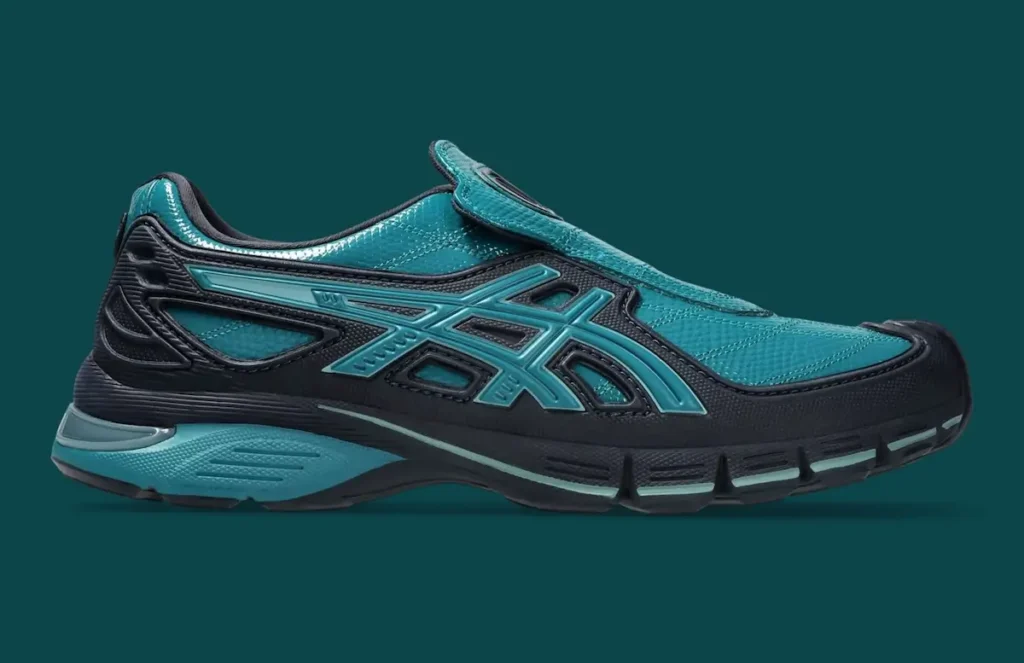 Close-up side profile of the OTTO 958 x ASICS Gel-SD Arzachotto in teal and black, featuring a glossy textured upper, laceless slip-on construction with an extended tongue flap, layered black structural overlays, and tonal ASICS Tiger Stripes integrated into a sculptural midsole with segmented cushioning