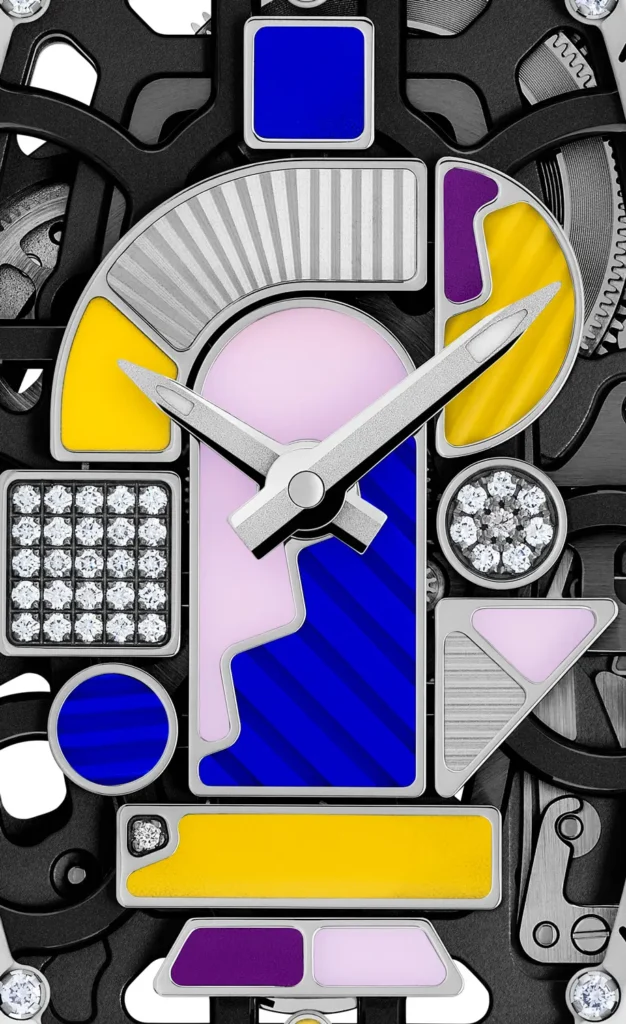 Macro view of the Richard Mille RM 07-01 dial featuring geometric colored inlays in blue, yellow, pink, and purple, surrounded by a skeletonized movement with diamond-set accents and brushed metal hands