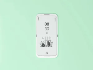 tinyBook Flip concept shown open with a monochrome E Ink display, featuring a minimalist interface with time, date, and subtle panda illustration on a soft mint background, emphasizing distraction-free design