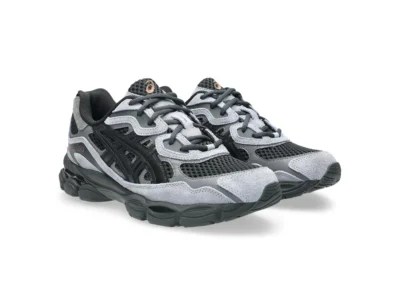 Angled side view of a pair of ASICS shoes in a black and grey colorway, featuring breathable mesh panels, layered suede overlays, signature ASICS side stripes, dark laces, and a sculpted sole with visible GEL cushioning units for added support