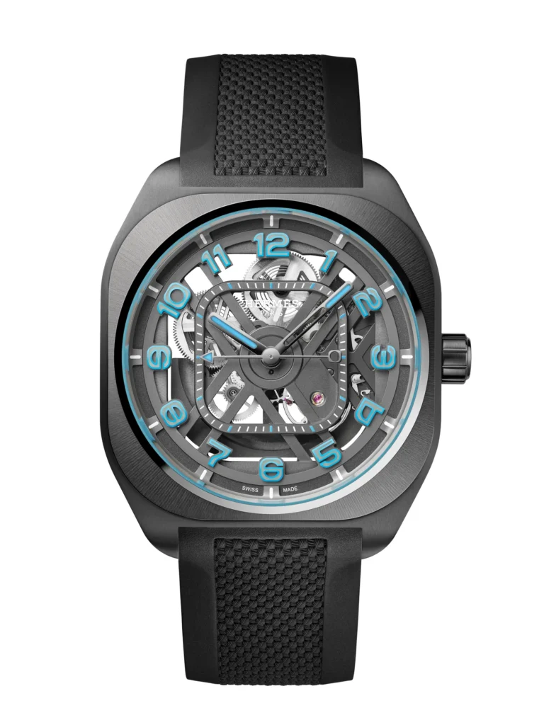 Skeletonized Hermès H08 wristwatch in matte black PVD-coated titanium, featuring an open-work dial that reveals the mechanical movement beneath, with bold blue Arabic numerals around the chapter ring, luminous hands, a geometric cushion-shaped case, and a textured black rubber strap against a clean white background