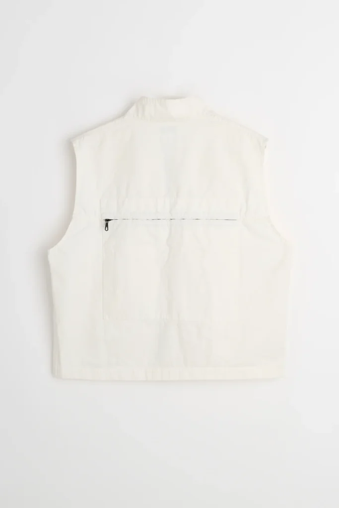 White C.P. Company 1990s cloth fabric utility gilet back view featuring a full-width horizontal zip pocket, clean panel construction, and structured cropped silhouette