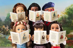 American Girl 40th anniversary original historical dolls including Samantha, Molly, Kirsten, Addy, and Josefina holding their classic storybooks in a nostalgic outdoor setting