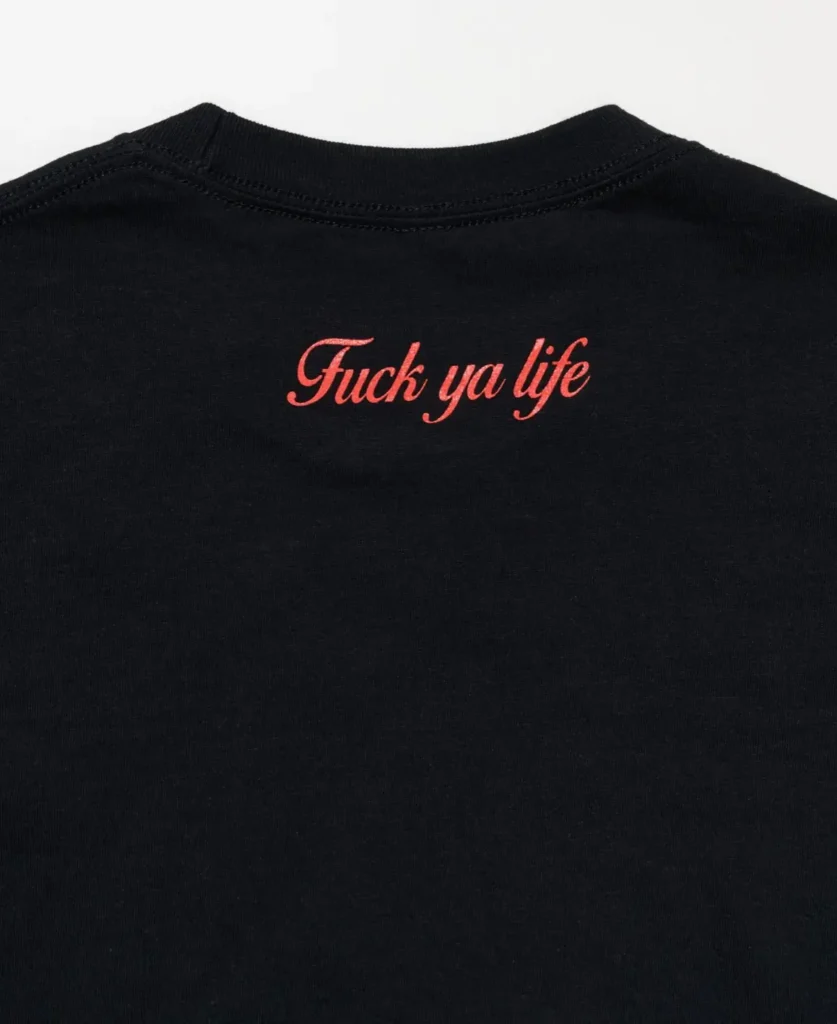 Black t-shirt with 'Fuck ya life' in distressed red cursive lettering on the back. Signature Skate Muzik drop, premium cotton with a vintage-washed feel